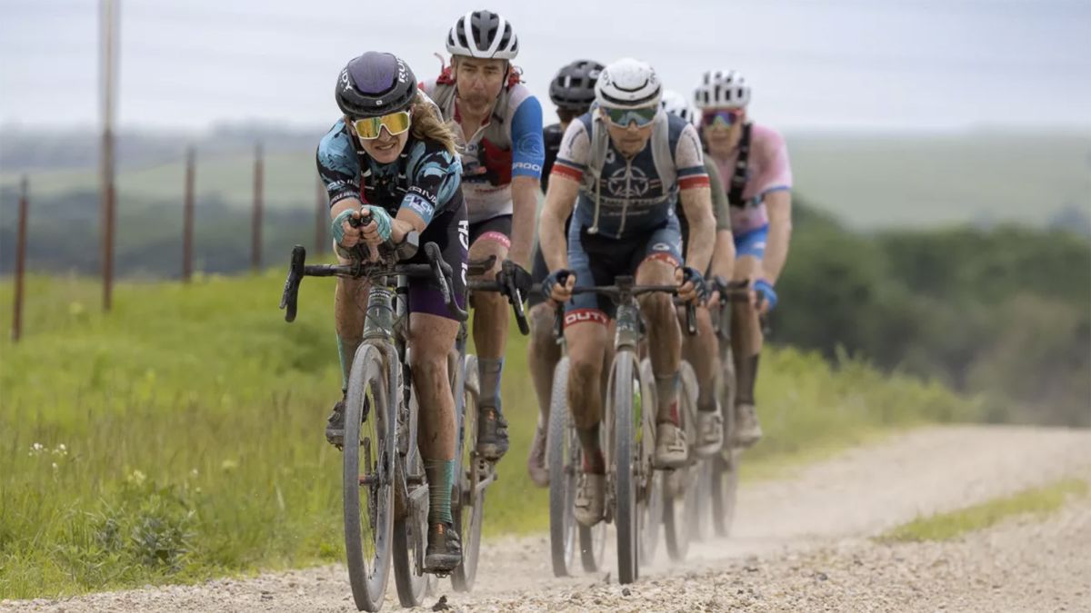 Lauren De Crescenzo (Cinch Rise) uses the aerobars in front of a group during 2022 Unbound Gravel 200