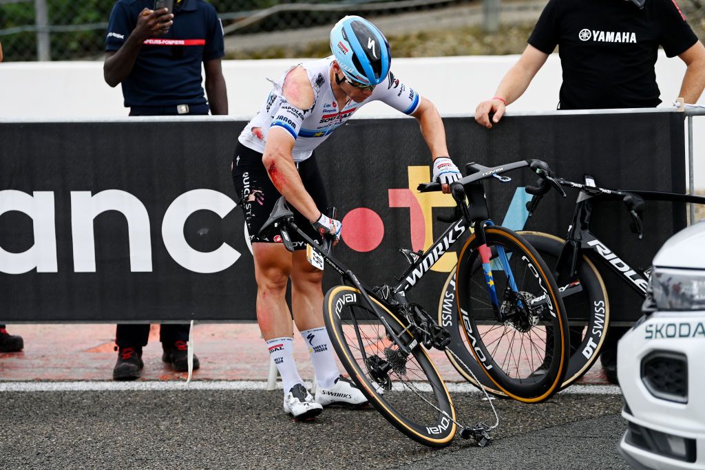 Fabio Jakobsen heavily scraped up and his bike broken in a high speed crash on stage 4 of the 2023 Tour de France in Nogaro