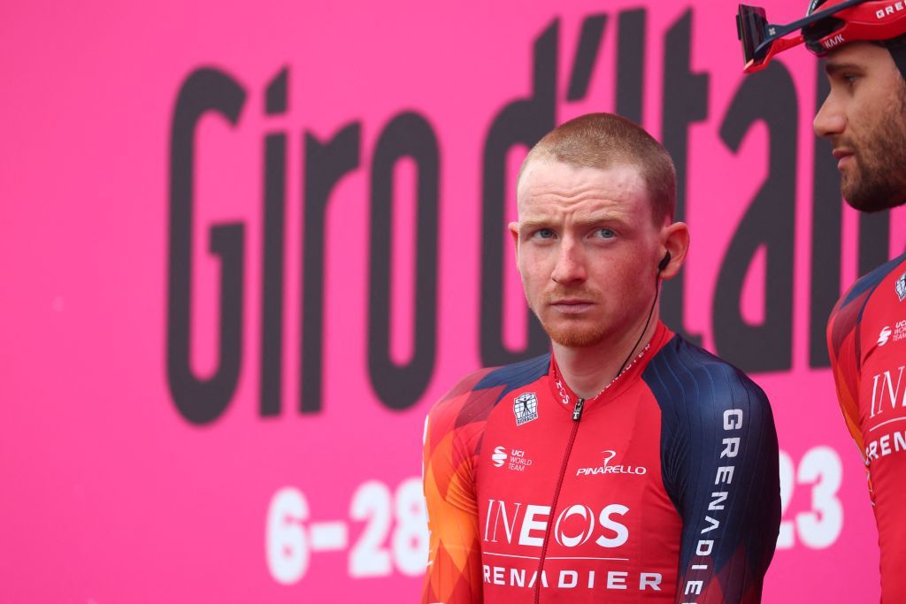 INEOS Grenadierss British rider Tao Geoghegan Hart stands on the podium during the teams presentation prior to the seventh stage of the Giro dItalia 2023 cycling race 218 km between Capua and Gran Sasso dItalia on May 12 2023 Photo by Luca Bettini AFP Photo by LUCA BETTINIAFP via Getty Images