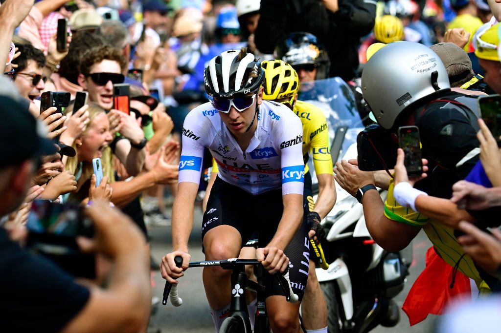 Tour de France 2023 stage 14: Tadej Pogacar (UAE Team Emirates) and Jonas Vingegaard (Jumbo-Visma) amid the wall of spectators on the climb
