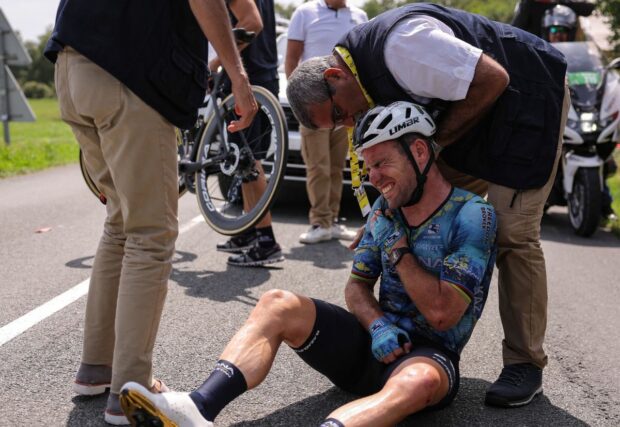 Mark Cavendish holds his collarbone after crashing out of the 2023 Tour de France on stage 8 to Limoges