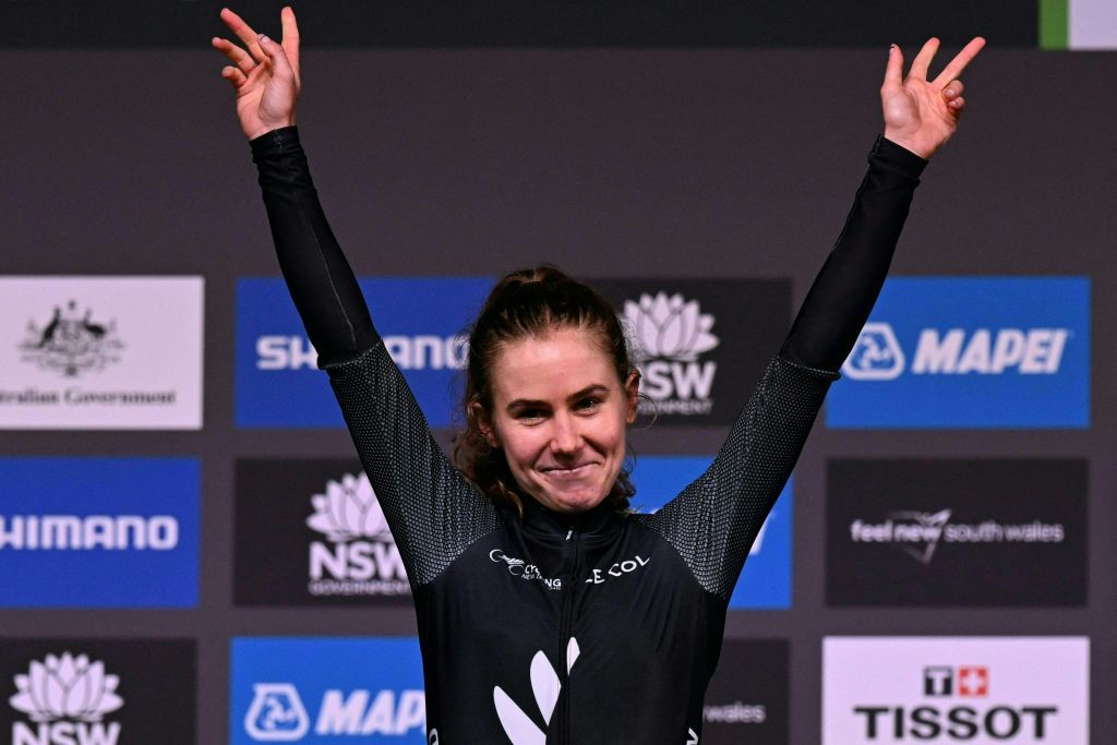 Niamh Fisher-Black on the podium at the 2023 Road World Championships in Wollongong after winning the U23 title in the road race