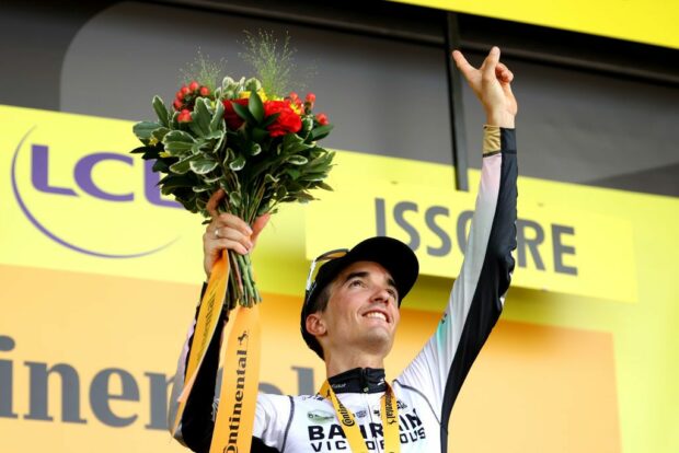 ISSOIRE FRANCE JULY 11 Pello Bilbao of Spain and Team Bahrain Victorious celebrates at podium as stage winner and dedicates the victory to his teammate Gino Mder of Switzerland during the stage ten of the 110th Tour de France 2023 a 1672km stage from Vulcania to Issoire UCIWT on July 11 2023 in Issoire France Photo by Michael SteeleGetty Images