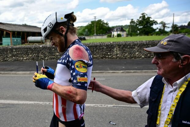 Lidl Treks US rider Quinn Simmons receives medical assistance after crashing during the 5th stage of the 110th edition of the Tour de France cycling race 163 km between Pau and Laruns in the Pyrenees mountains in southwestern France on July 5 2023 Photo by Marco BERTORELLO AFP Photo by MARCO BERTORELLOAFP via Getty Images