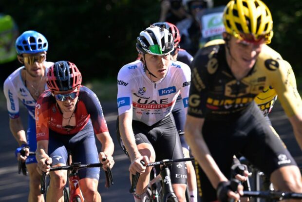 Tom Pidcock (INEOS Grenadiers) with Tadej Pogacar (UAE Team Emirates) on the slopes of the Puy de Dôme