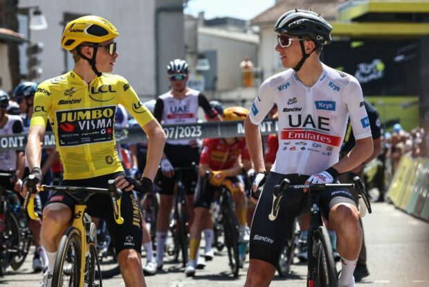 JumboVismas Danish rider Jonas Vingegaard wearing the overall leaders yellow jersey L speaks with UAE Team Emirates Slovenian rider Tadej Pogacar wearing the best young riders white jersey R as they await the start of the 7th stage of the 110th edition of the Tour de France cycling race 170 km between MontdeMarsan and Bordeaux in southwestern France on July 7 2023 Photo by AnneChristine POUJOULAT AFP Photo by ANNECHRISTINE POUJOULATAFP via Getty Images
