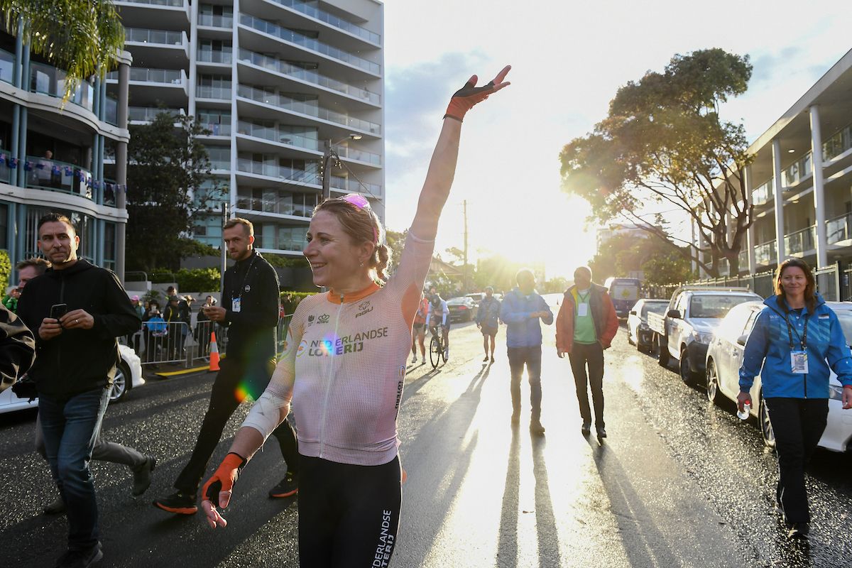 Annemiek van Vleuten waves after winning the Road World Championships in Wollongong in 2022