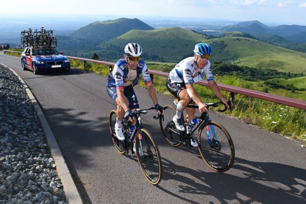 Michael Mørkøv rides up the Puy de Dôme alongside Soudal-QuickStep sprinter Fabio Jakobsen at the 2023 Tour de France