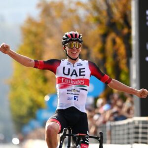 Tadej Pogacar crossing the line as he wins Il Lombardia 2022