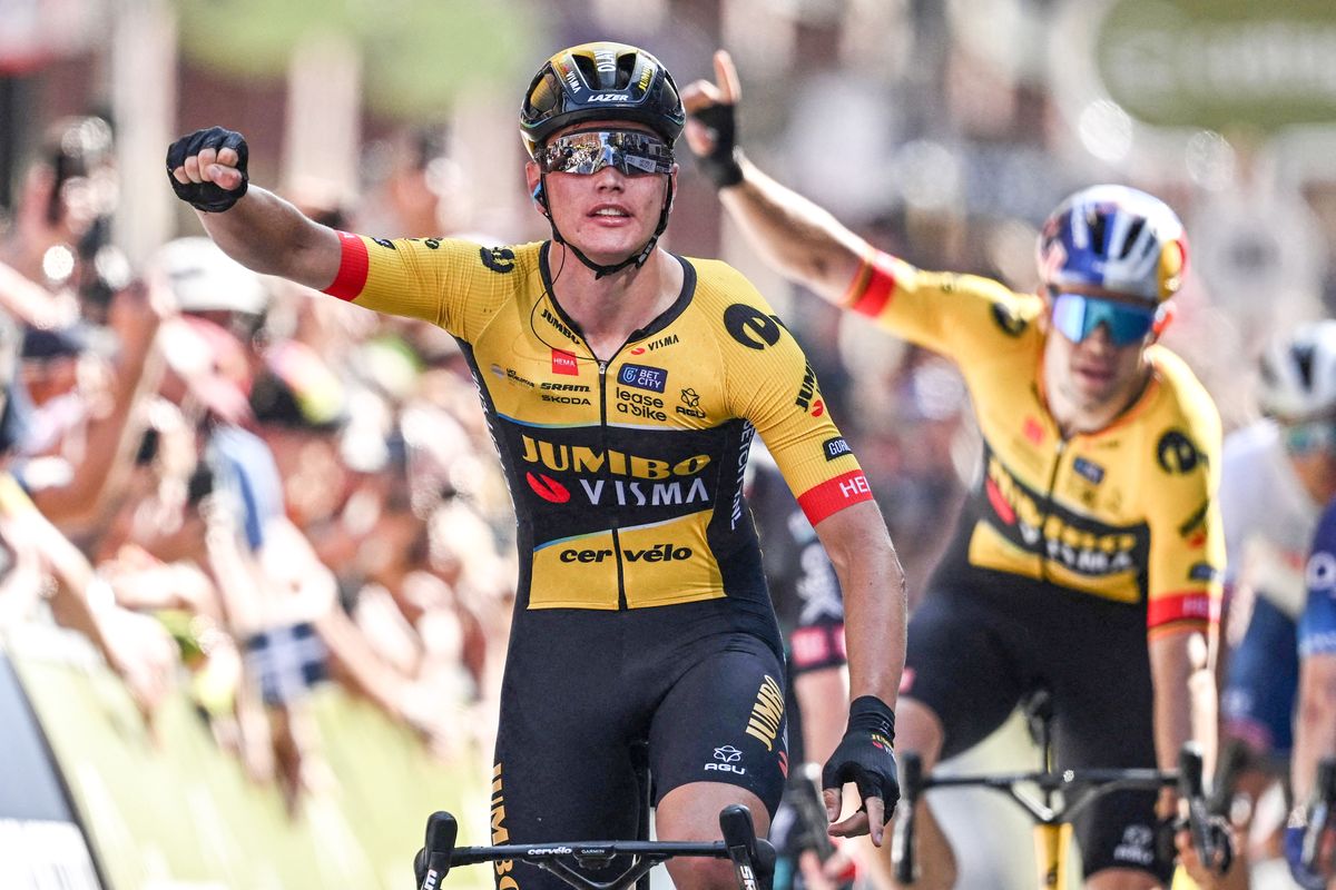 Olav Kooij and Wout van Aert celebrate a 1-2 on the opening stage of the 2023 Tour of Britain