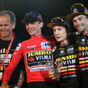 Richard Plugge with Sepp Kuss, Jonas Vingegaard and Primoz Roglic after they swept the Vuelta podium.