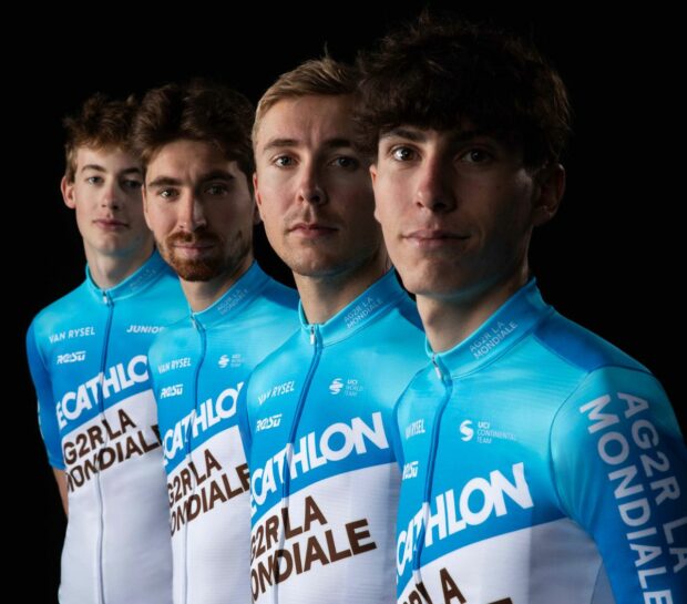 Benoit Cosnefroy and several Decathlon AG2R La Mondiale teammates show off the 2024 jersey
