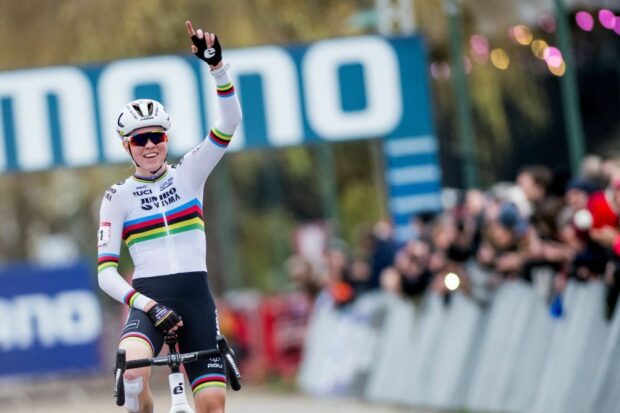 Dutch Fem Van Empel celebrates as she crosses the finish line to win the elite women