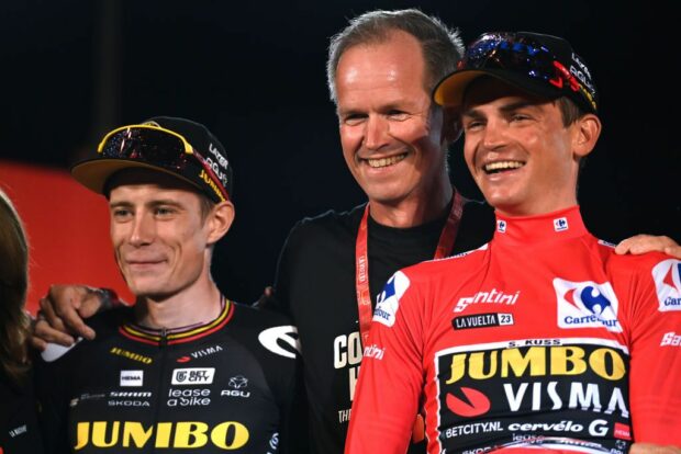 Jonas Vingegaard, Jumbo-Visma team boss Richard Plugge, and Sepp Kuss on the final podium of the 2023 Vuelta a España