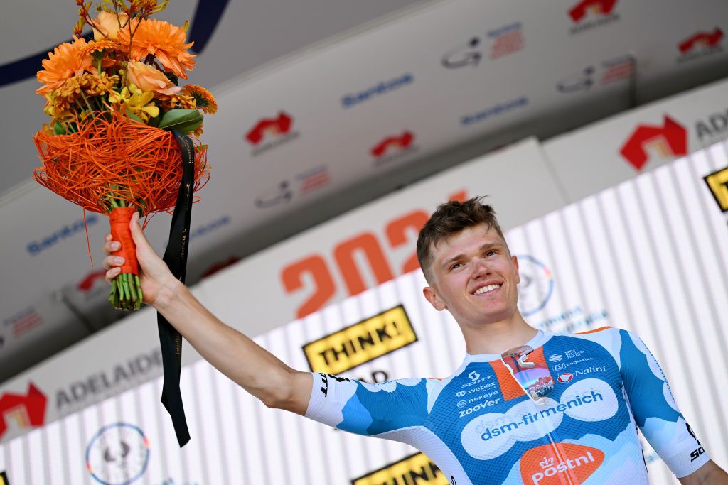 WILLUNGA AUSTRALIA JANUARY 20 Oscar Onley of United Kingdom and Team dsmfirmenich PostNL celebrates at podium as stage winner during the 24th Santos Tour Down Under 2024 Stage 5 a 1293km stage from Christies Beach to Willunga Hill 372m on January 20 2024 in Willunga Hill Australia Photo by Tim de WaeleGetty Images
