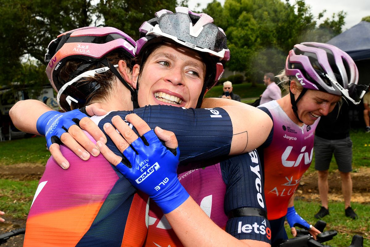Ruby Roseman-Gannon (Jayco-AlUla) is congratulated by teammates after winning the elite women