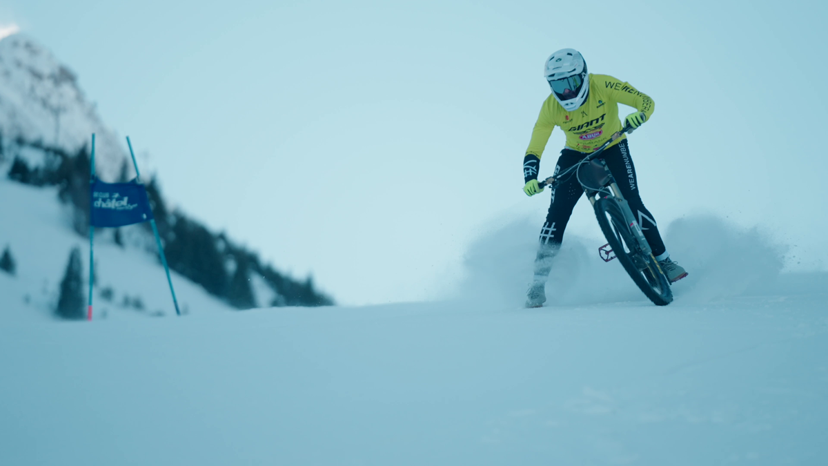 A shot of a rider tackling a snow bike course