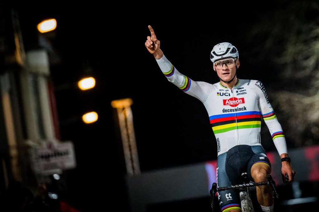 Dutch rider Mathieu Van Der Poel celebrates as he crosses the finish line to win the mens elite race of the Superprestige cyclocross cycling event in Diegem, on December 28, 2023. (Photo by JASPER JACOBS / Belga / AFP) / Belgium OUT