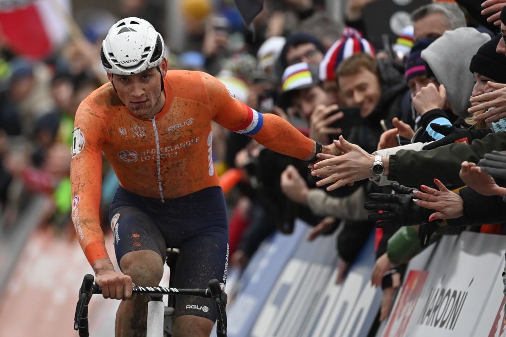 Mathieu van der Poel celebrates with the crowd as he races to his sixth world cyclocross title in Tabor