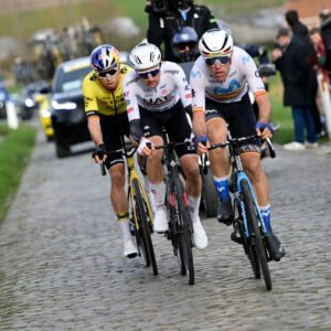 The podium trio – Oier Lazkano leads Tim Wellens and Wout van Aert over the cobbles of Kuurne-Brussel-Kuurne