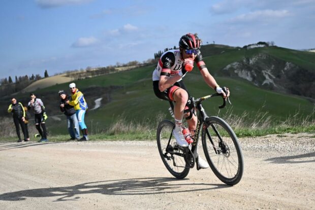 Tadej Pogacar racing the sterrato on the way to victory at the 2022 Strade Bianche