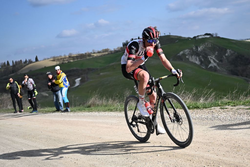 Tadej Pogacar racing the sterrato on the way to victory at the 2022 Strade Bianche