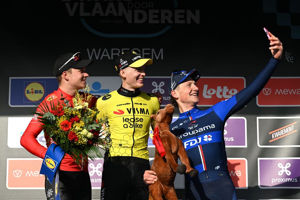 WAREGEM BELGIUM MARCH 27 LR Jonas Abrahamsen of Norway and Team UnoX Mobility on second place race winner Matteo Jorgenson of The United States and Team Visma Lease a Bike and Stefan Kung of Switzerland and Team Groupama FDJ on third place pose and take a selfie on the podium ceremony after the 78th Dwars Door Vlaanderen 2024 Mens Elite a 1886km one day race from Roeselare to Waregem UCIWT on March 27 2024 in Waregem Belgium Photo by Tim de WaeleGetty Images