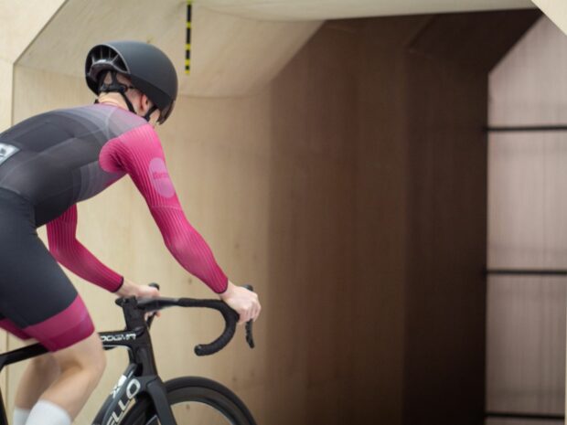 Tom Wieckowski wears Poc Procen Air helmet while riding a bike in a wind tunnel