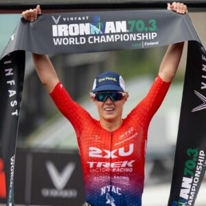 Taylor Knibb celebrates her Ironman 70.3 World Championships victory in Finland in 2023