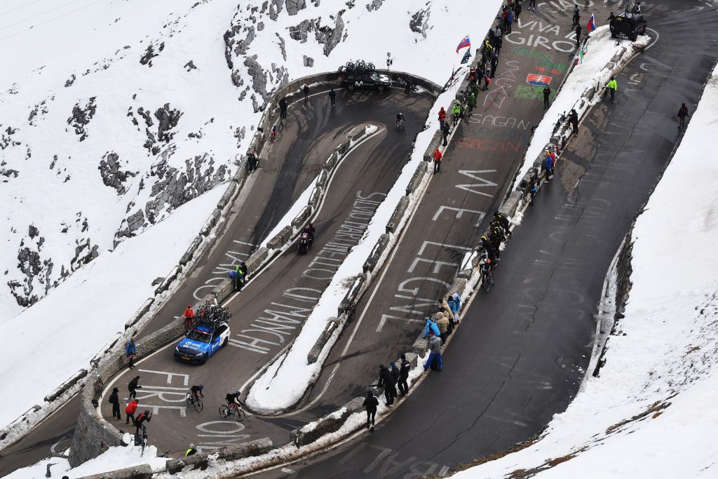 LAGHI DI CANCANO ITALY OCTOBER 22 Domenico Pozzovivo of Italy and NTT Pro Cycling Team Matteo Sobrero of Italy and NTT Pro Cycling Team Passo dello Stelvio Stilfserjoch 2758m Snow Fans Public during the 103rd Giro dItalia 2020 Stage 18 a 207km stage from Pinzolo to Laghi di Cancano Parco Nazionale dello Stelvio 1945m girodiitalia Giro on October 22 2020 in Laghi di Cancano Italy Photo by Tim de WaeleGetty Images