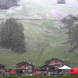 SPONDINIG ITALY MAY 21 Team INEOS Grenadiers caravan on the way to the new start in snow and rain prior to the 107th Giro dItalia 2024 Stage 16 a 121km stage from Spondinig to Santa Cristina Valgardena Monte Pana 1625m Route and stage modified due to adverse weather conditions UCIWT on May 21 2024 in Prato di Stelvio Italy Photo by Tim de WaeleGetty Images
