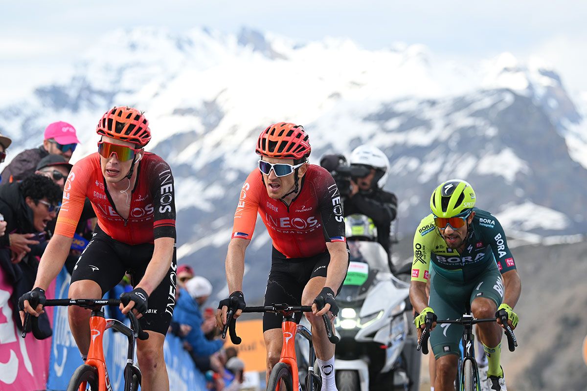 Geraint Thomas races towards the finish of stage 15 at Livigno alongside teammate Thymen Arensman and GC rival Dani Martínez