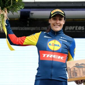 Lucinda Brand celebrates at podium as most combative rider prize winner during the 9th Vuelta a Burgos Feminas 2024