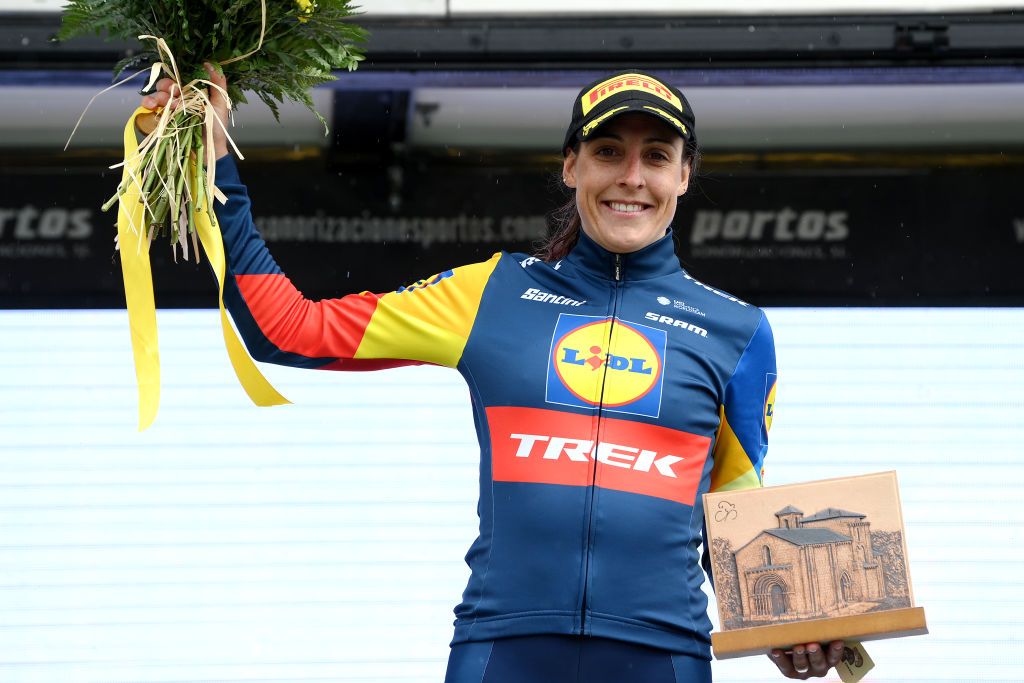 Lucinda Brand celebrates at podium as most combative rider prize winner during the 9th Vuelta a Burgos Feminas 2024