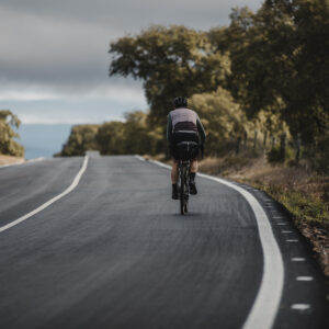 Bikepacking rider on tarmac road