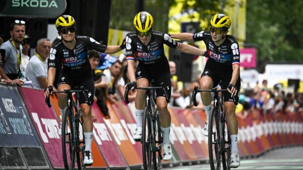 Demi Vollering being helped by her teammates during Stage 3 of the 2025 Tour de France Femmes