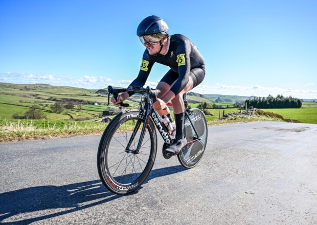 A man cycles in a time trial