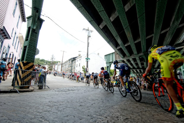 cyclists under a bridge