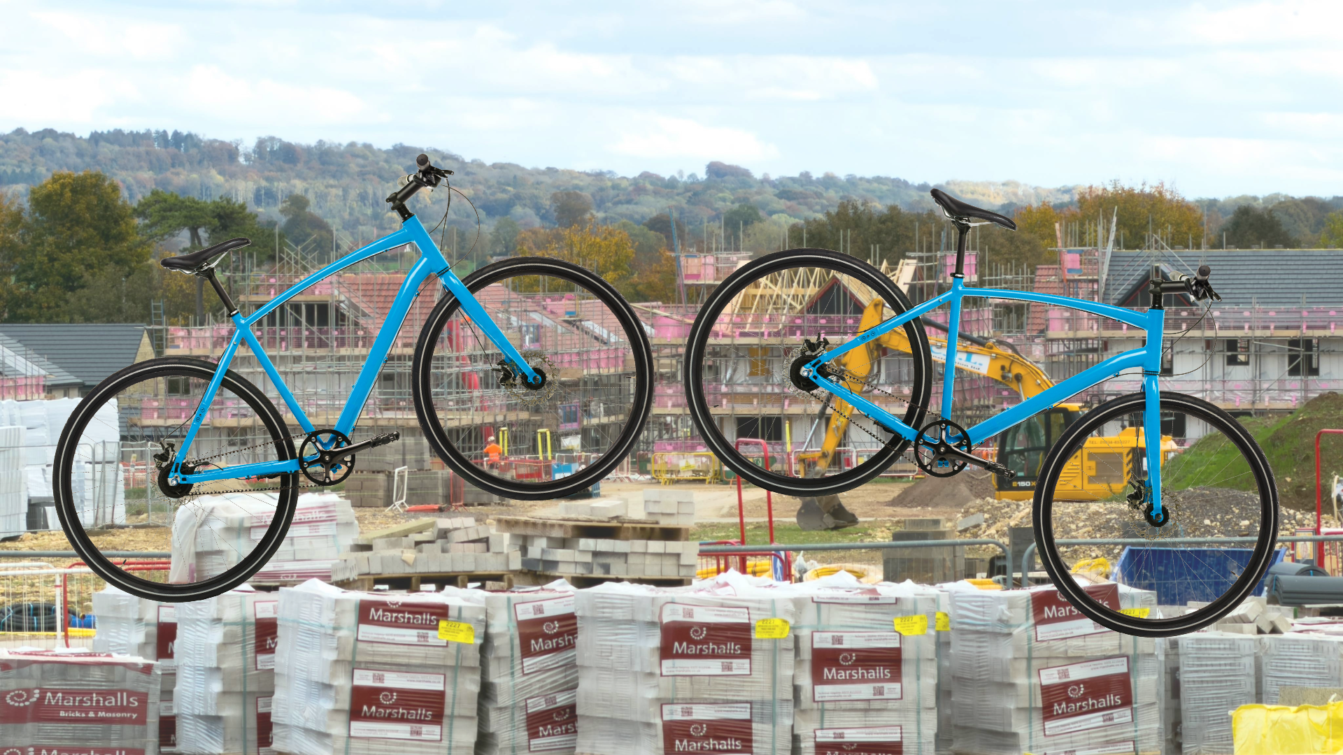 Two bikes layed over a housing development building site