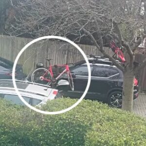 A thief on a moped stealing a JAKROO handsling bike